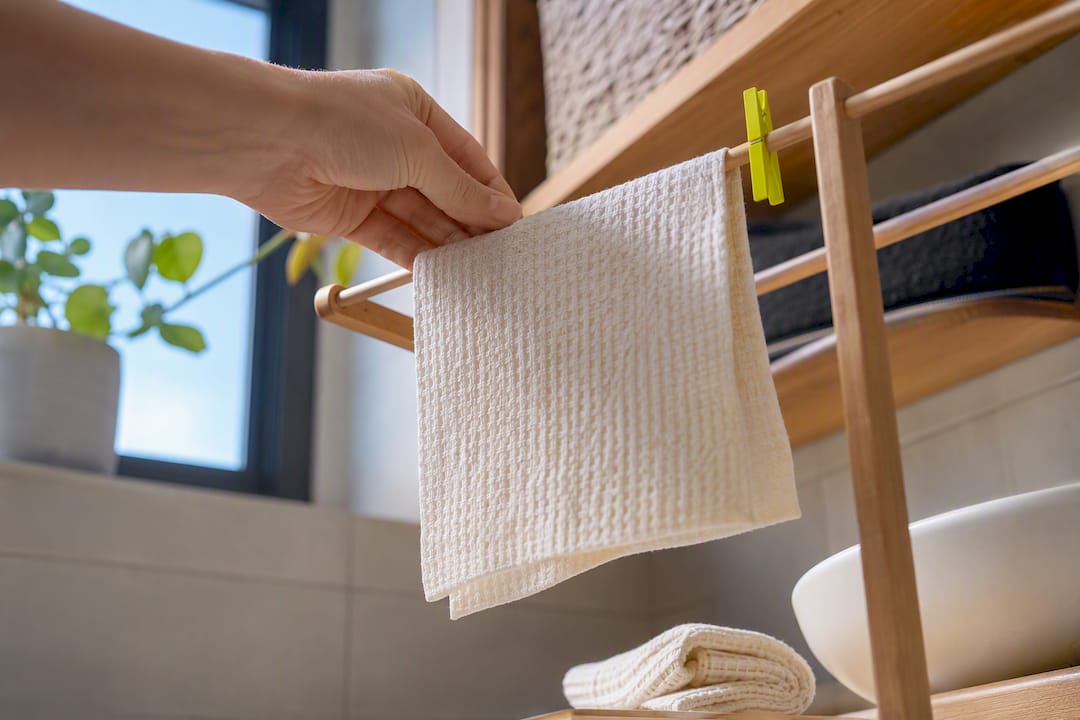 Anonymous dishcloth drying after rinsing